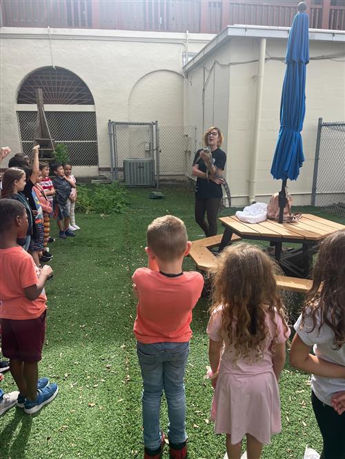 First graders learning about an alligator